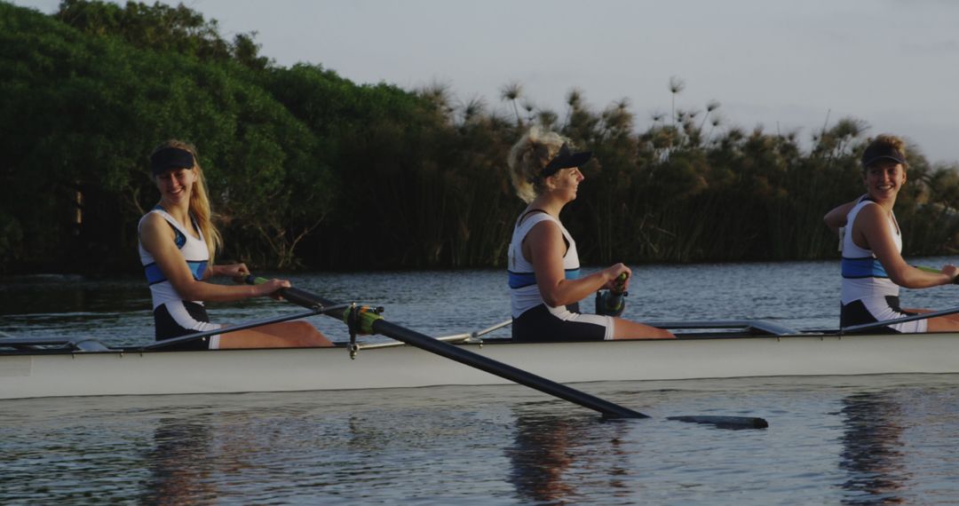 Female Rowing Team Training on Lake - Free Images, Stock Photos and Pictures on Pikwizard.com