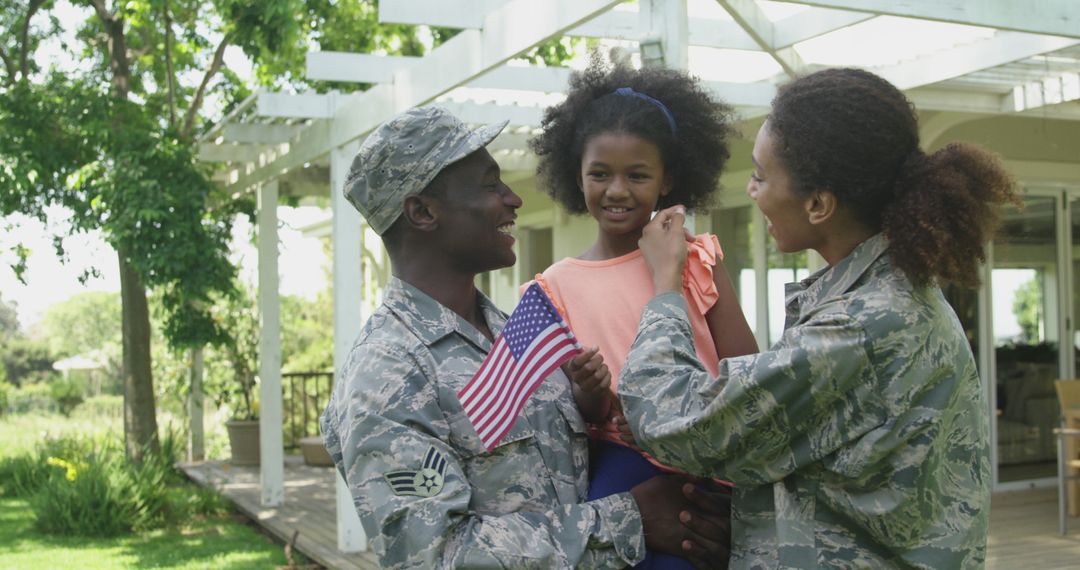 Military Family Reuniting with Daughter Holding American Flag - Free Images, Stock Photos and Pictures on Pikwizard.com