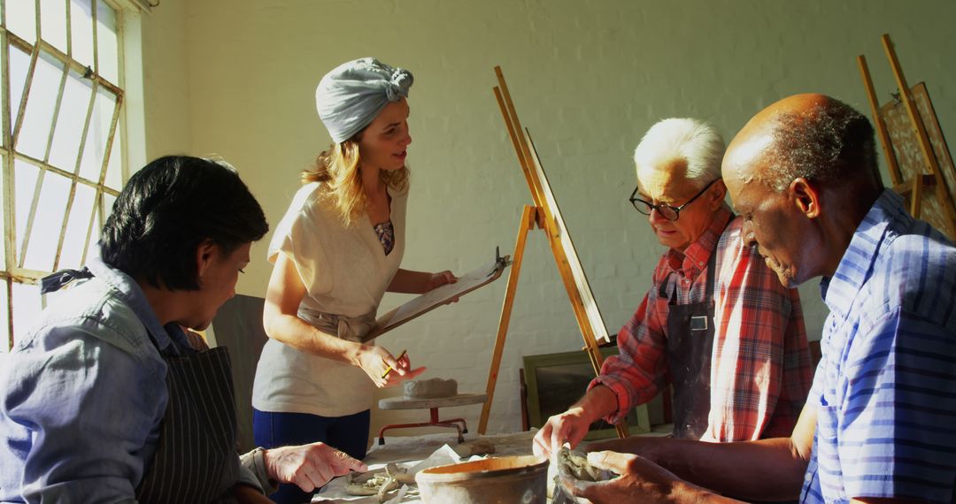 Art Teacher Assisting Seniors in Pottery Class - Free Images, Stock Photos and Pictures on Pikwizard.com