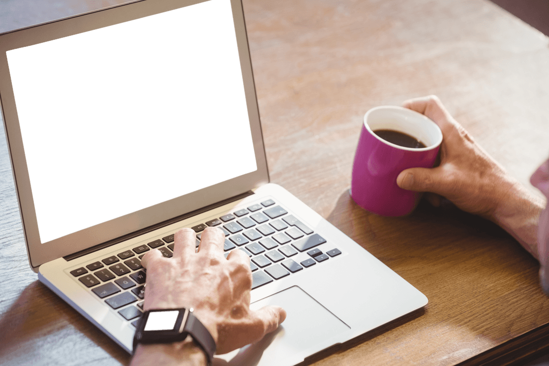 Man with Coffee Cup Typing on Laptop with Transparent Screen