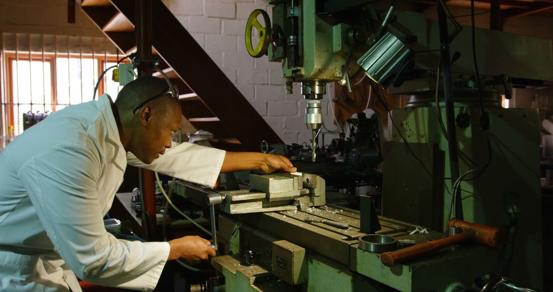 Engineer Operating Heavy Industrial Machine in Workshop - Free Images, Stock Photos and Pictures on Pikwizard.com