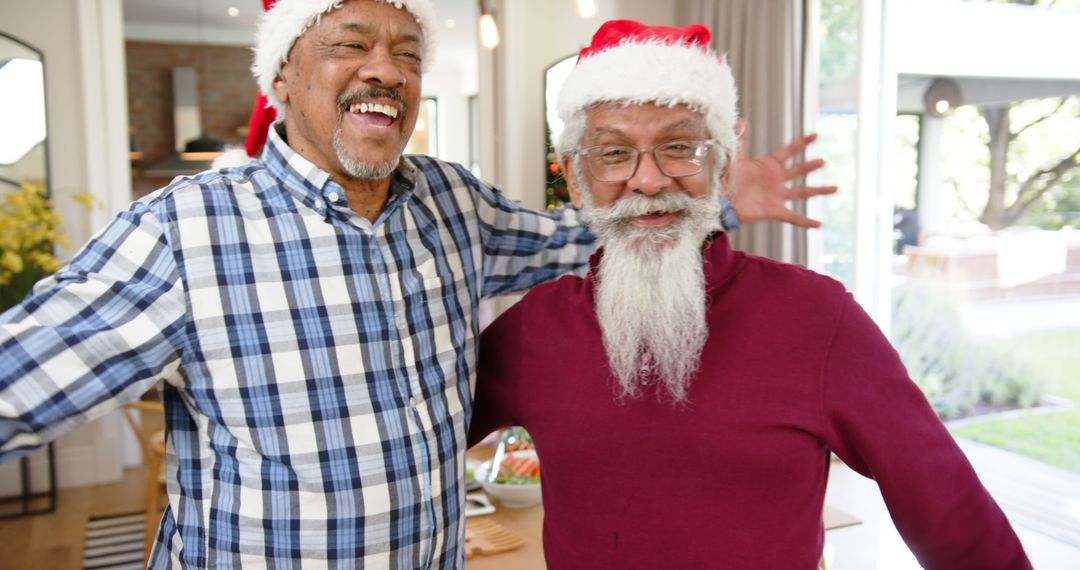 Happy Elderly Men Celebrating Christmas in Santa Hats - Free Images, Stock Photos and Pictures on Pikwizard.com