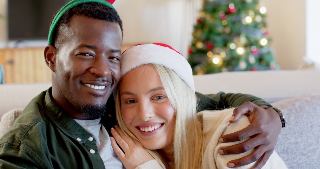 Diverse Couple Sharing Holiday Smiles with Festive Christmas Background