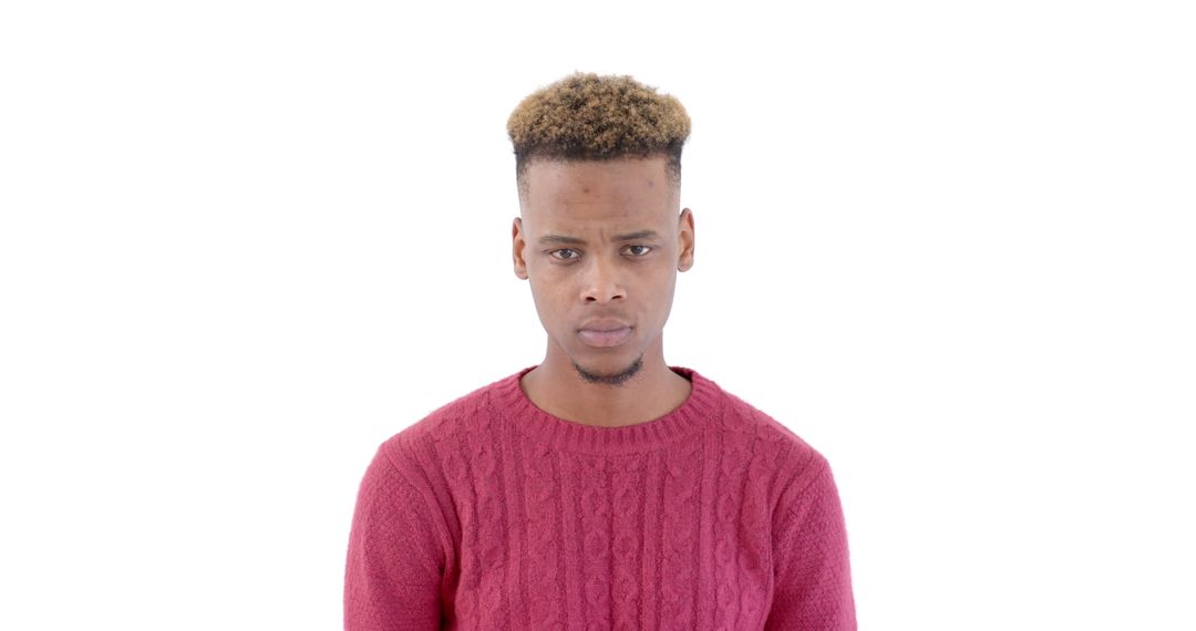 Serious Man in Red Sweater Posing Against White Background
