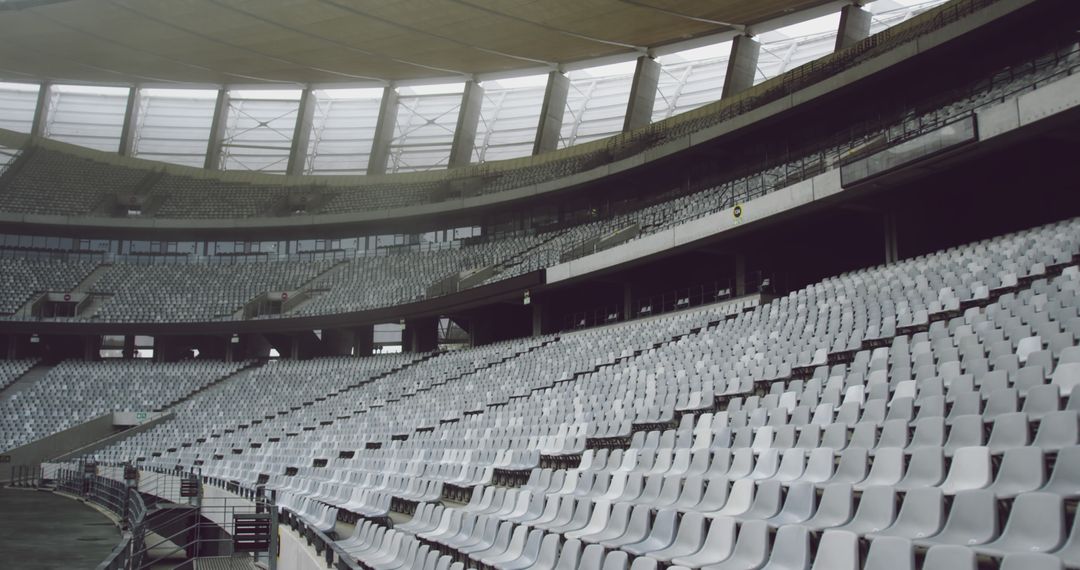 Empty Stadium Seating with Modern Architecture and Curved Roof - Free Images, Stock Photos and Pictures on Pikwizard.com