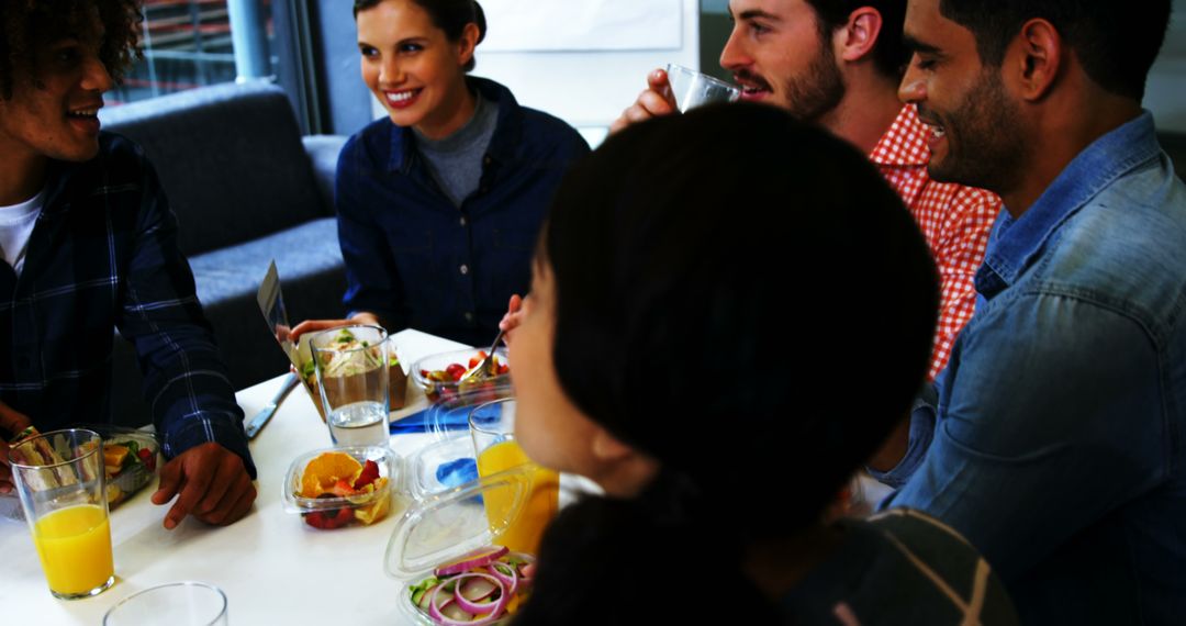 Diverse Team Enjoying Lunch Together in Office Breakroom - Free Images, Stock Photos and Pictures on Pikwizard.com