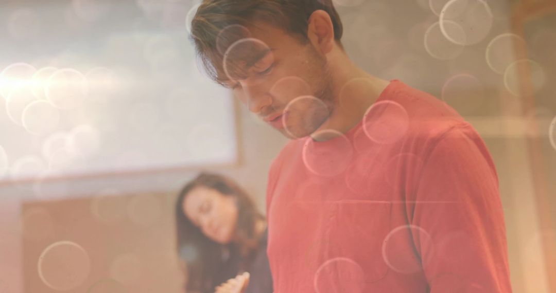 Focused Man Writing in Bright Office Environment with Creative Vibes