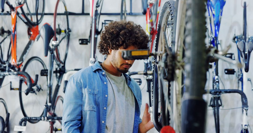 Mechanic Tuning Bicycle in Modern Bike Workshop