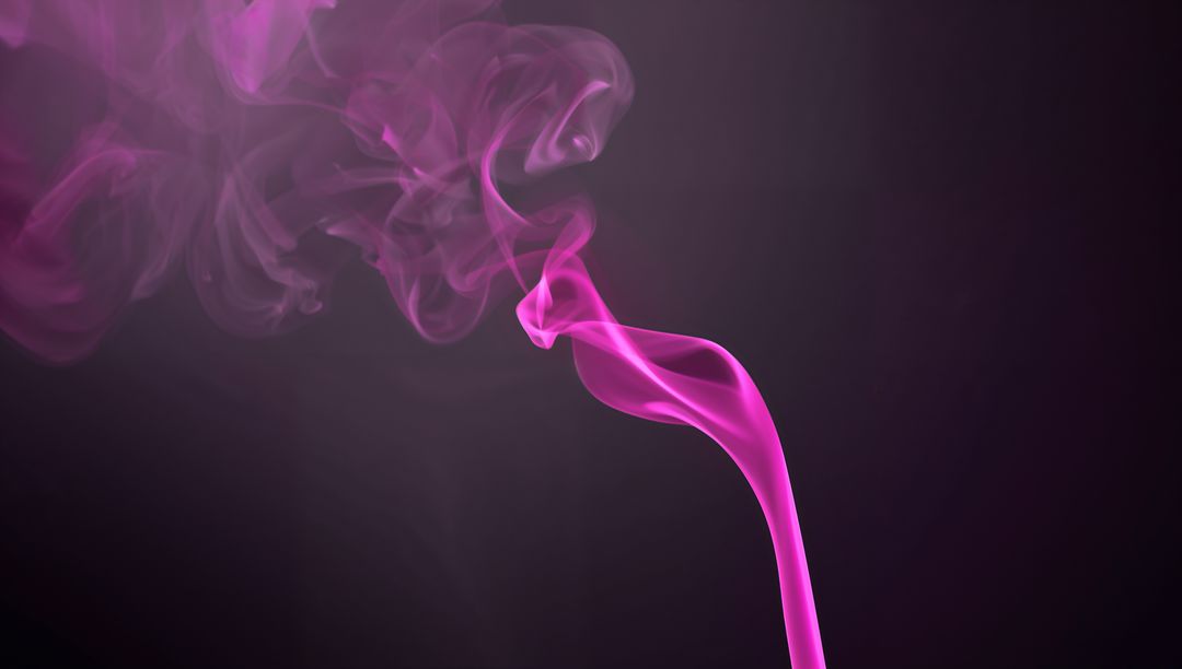 Swirling Magenta Smoke Creating Abstract Patterns