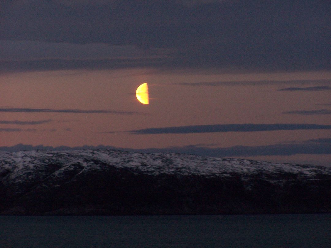 Orange Moon Rising Over Snow-Covered Mountains - Free Images, Stock Photos and Pictures on Pikwizard.com