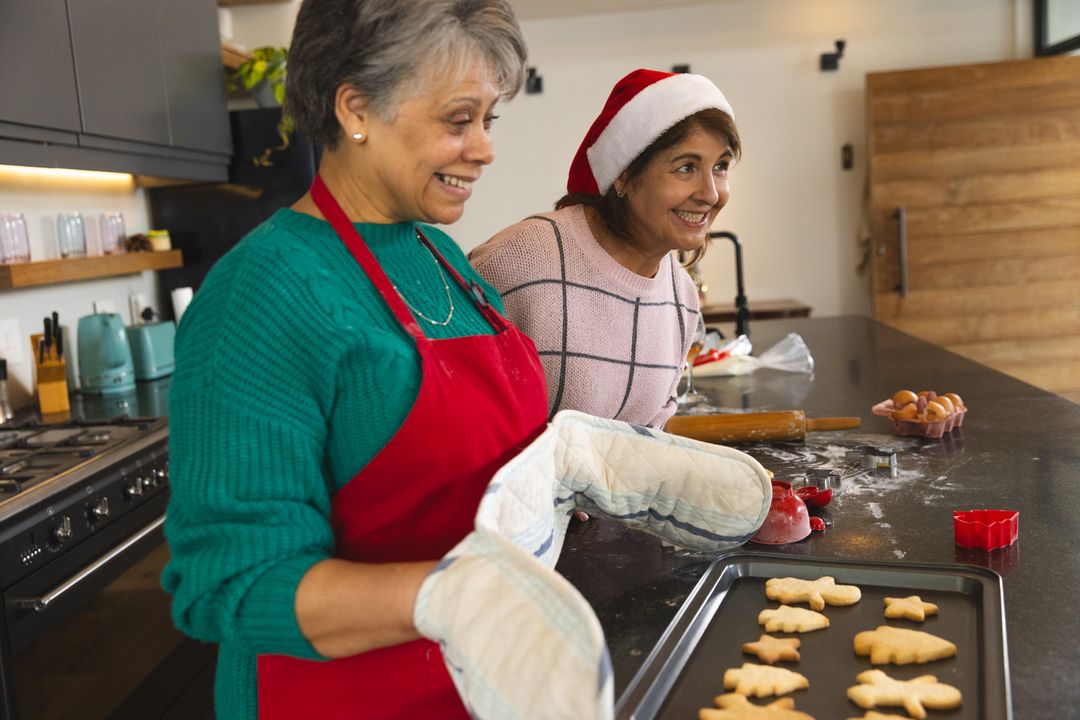Smiling Mother and Daughter Baking Holiday Cookies at Home