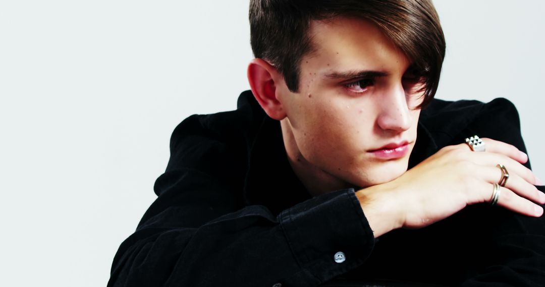 Pensive Young Man in Deep Thought with Contemplative Expression