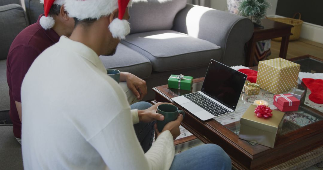 Couple Celebrating Christmas with Video Call and Gifts - Free Images, Stock Photos and Pictures on Pikwizard.com