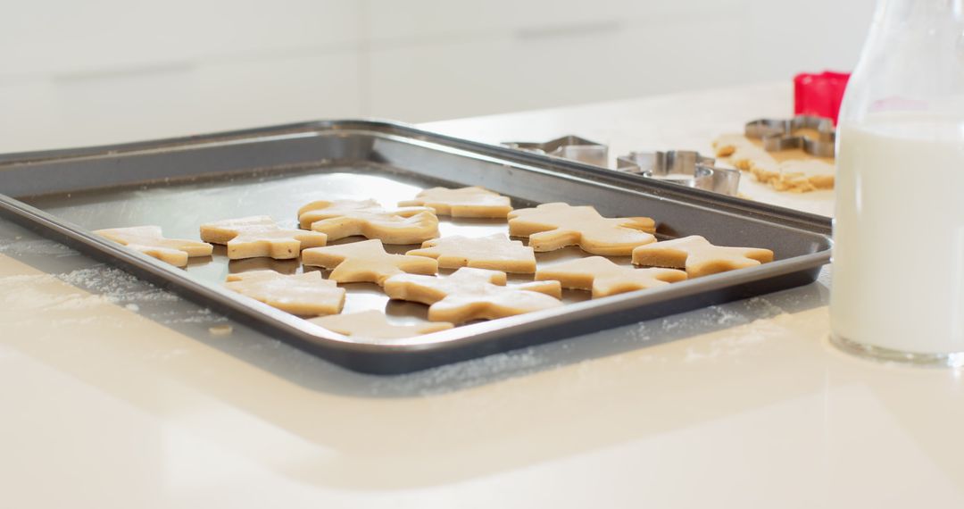 Unbaked Sugar Cookie Shapes on Baking Sheet in Home Kitchen