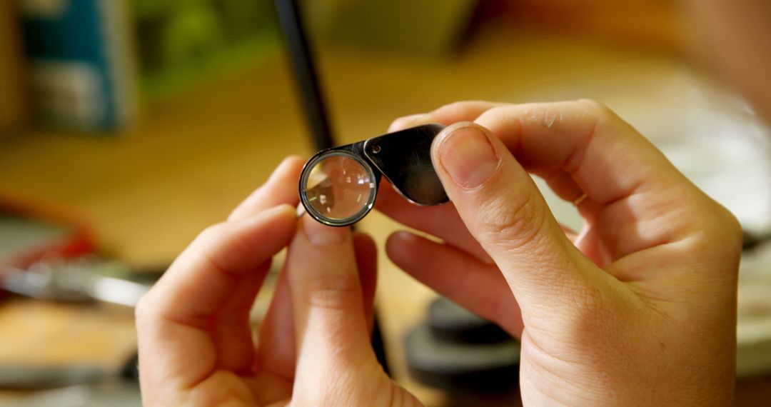 Hands Examining Gemstone with Jeweler's Loupe Device - Free Images, Stock Photos and Pictures on Pikwizard.com