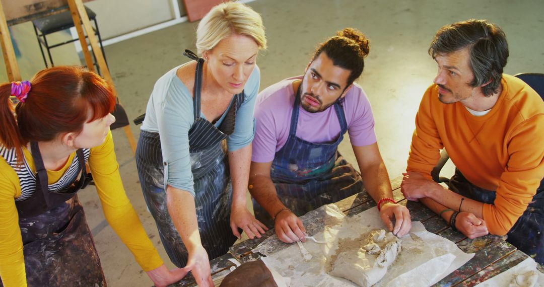 Diverse Adults Engaged in Art Class Collaboration