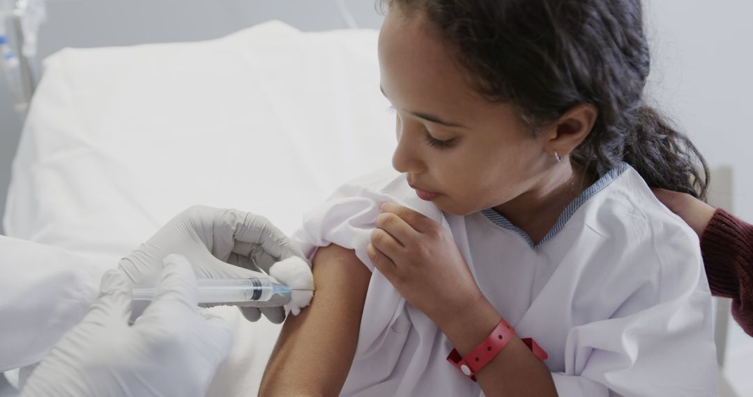 Young Girl Receiving Vaccination in Medical Clinic - Free Images, Stock Photos and Pictures on Pikwizard.com