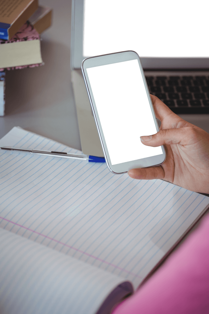 Transparent Smartphone Over Notebook in Educational Setting