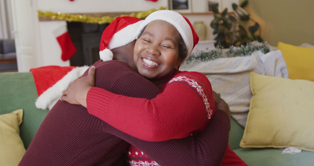 Happy Couple Hugging on Christmas Morning in Festive Living Room - Free Images, Stock Photos and Pictures on Pikwizard.com