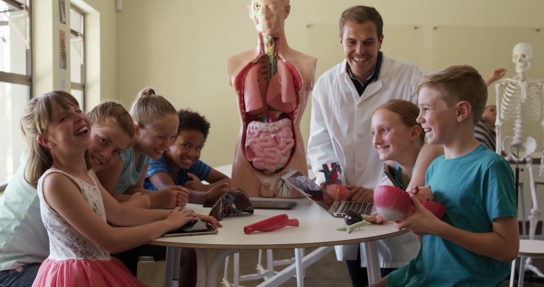 Teacher Engaging Students with Human Anatomy Models in Classroom - Free Images, Stock Photos and Pictures on Pikwizard.com