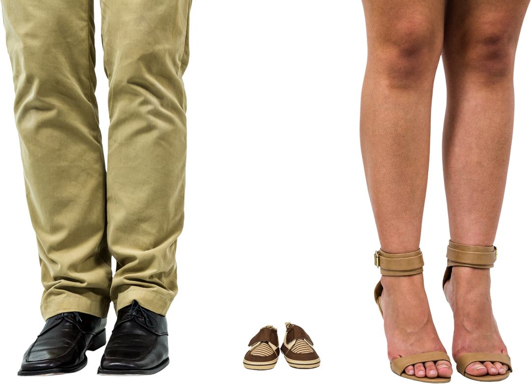 Low section of couple standing beside baby booties on transparent background - Download Free Stock Images Pikwizard.com