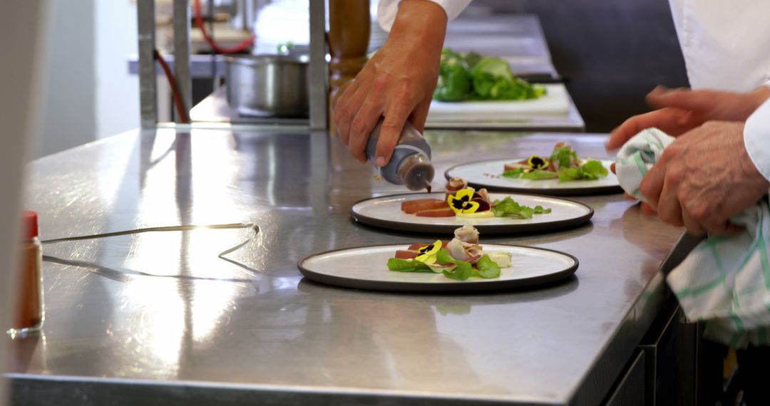 Chef Plating Gourmet Dishes in a Professional Kitchen - Free Images, Stock Photos and Pictures on Pikwizard.com