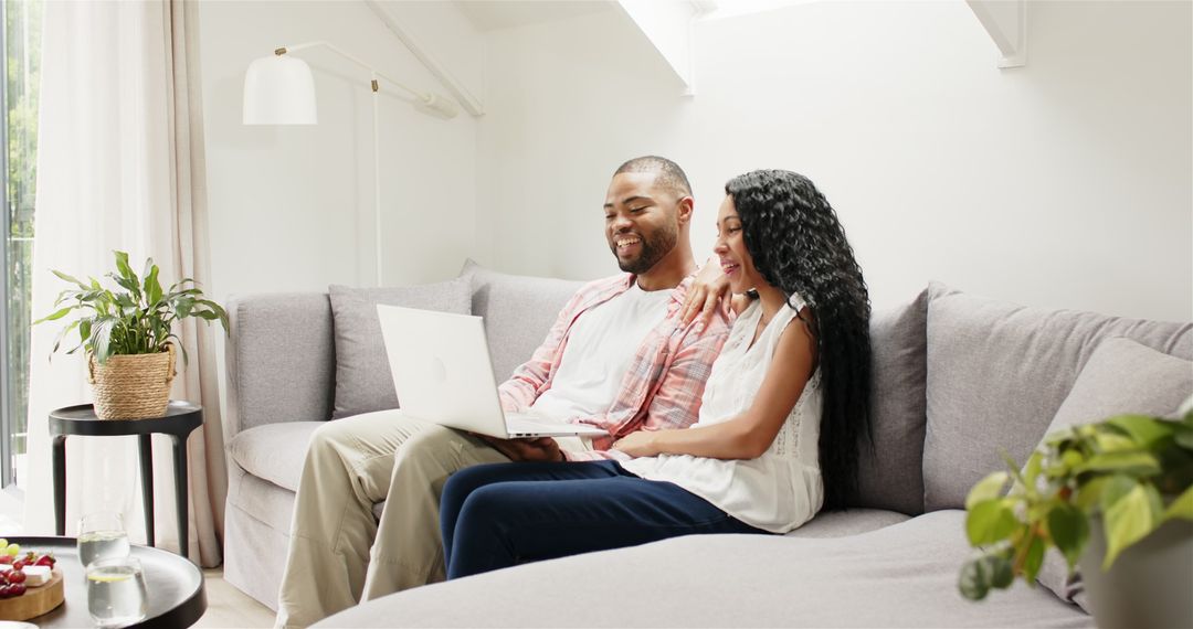 Smiling Multiracial Couple Enjoying Video Call at Home