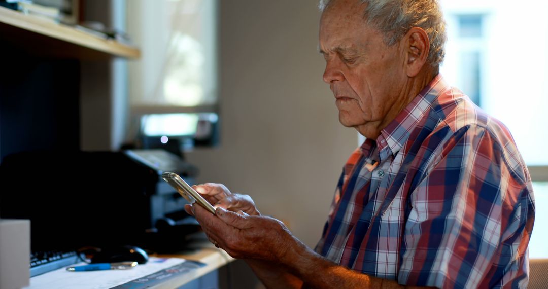 Senior Man Using Smartphone in Home Office - Free Images, Stock Photos and Pictures on Pikwizard.com