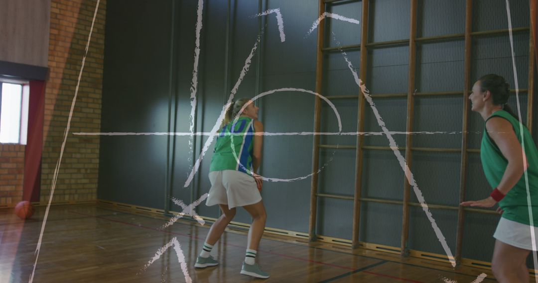 Female Basketball Players with Strategy Lines on Court
