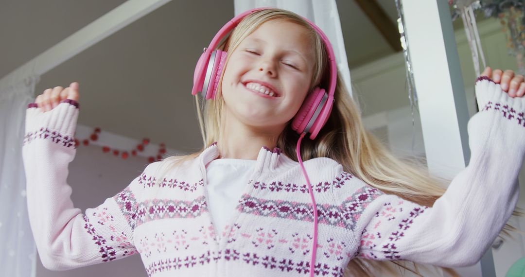 Joyful Young Girl Listening to Music with Headphones - Free Images, Stock Photos and Pictures on Pikwizard.com