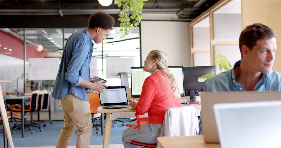 Creative Professionals Collaborating in Open Office Space