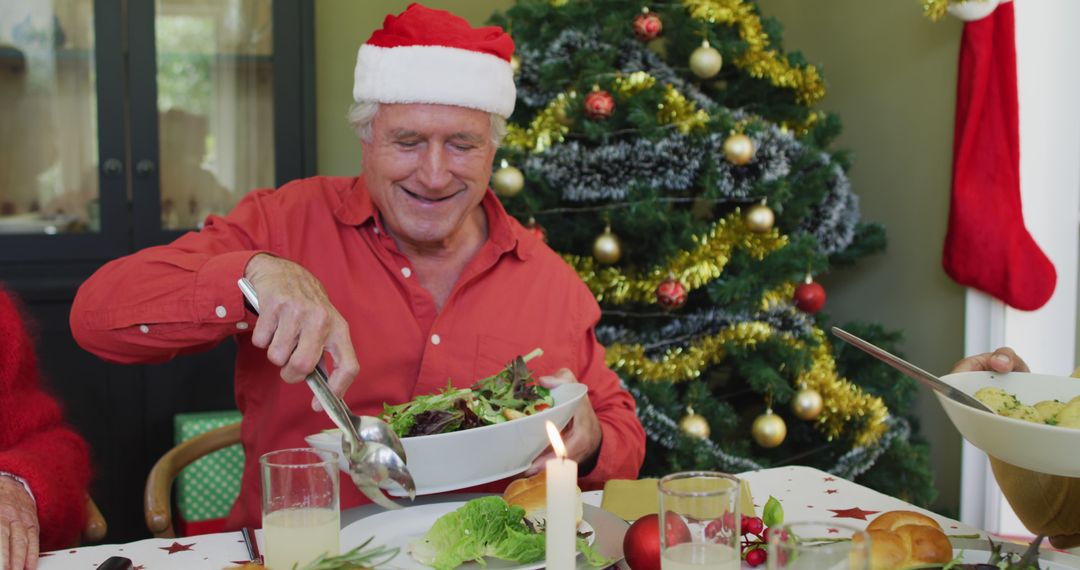 Smiling Elderly Man Enjoying Christmas Meal Near Decorated Tree - Free Images, Stock Photos and Pictures on Pikwizard.com