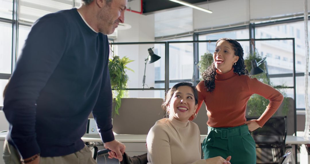 Diverse Team Collaborating in Bright Open-Plan Office, Smiling and Brainstorming