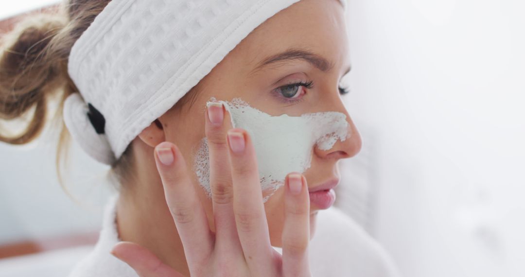 Woman Applying Skincare Mask at Home for Facial Treatment - Free Images, Stock Photos and Pictures on Pikwizard.com