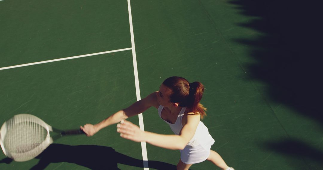 Female Tennis Player Hitting Shot on Court - Free Images, Stock Photos and Pictures on Pikwizard.com