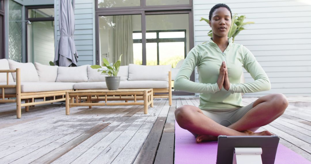 Woman Practicing Yoga Outdoors with Digital Tablet for Guidance - Free Images, Stock Photos and Pictures on Pikwizard.com