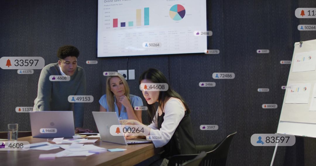 Business Team Analyzing Data and Sales Metrics in Meeting Room