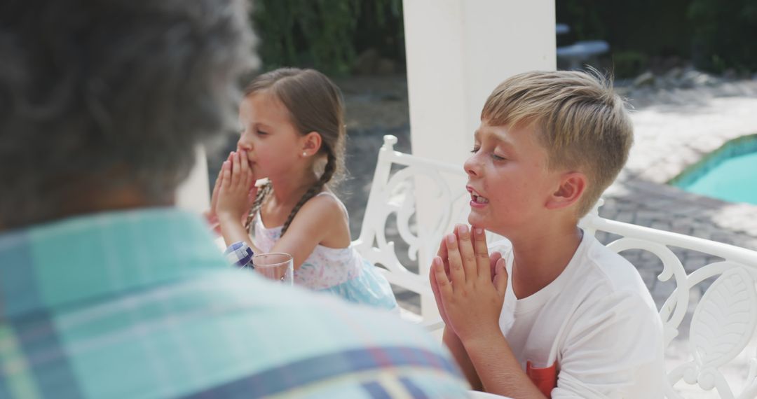 Children Praying at Outdoor Dinner Table - Free Images, Stock Photos and Pictures on Pikwizard.com