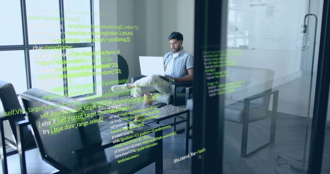 Indian Software Engineer Coding in Modern Office Lounge