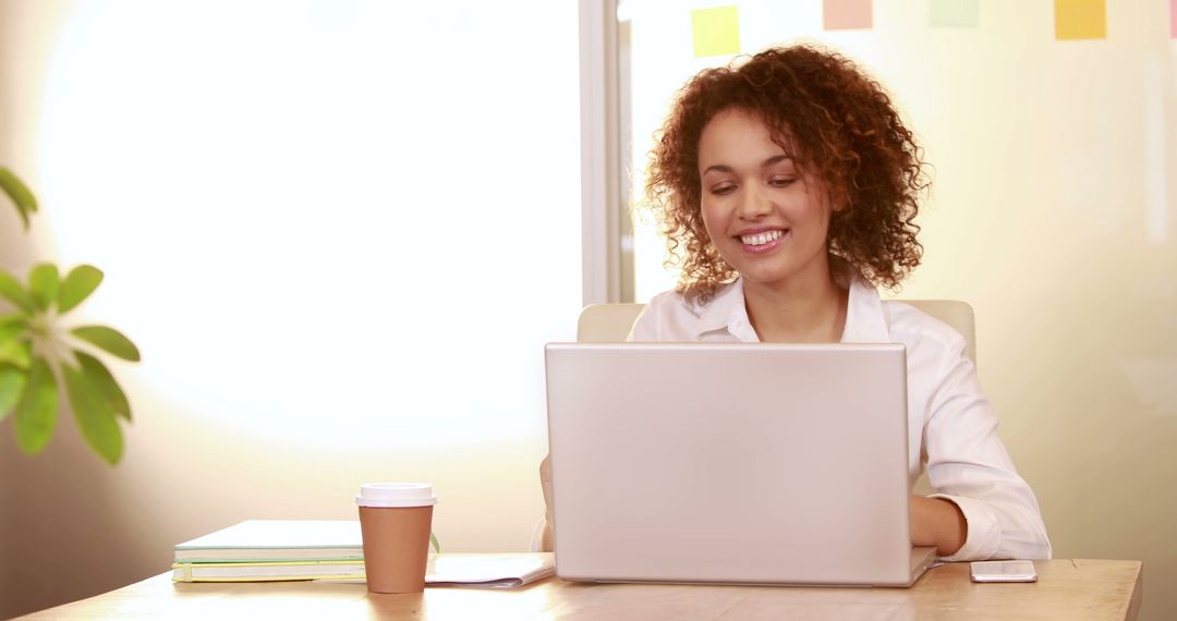 Young Professional Woman Working on Laptop in Office - Free Images, Stock Photos and Pictures on Pikwizard.com