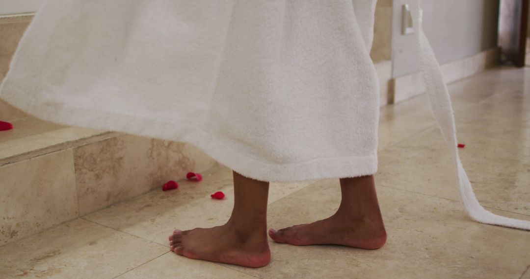 Child in White Towel with Rose Petals on Floor - Free Images, Stock Photos and Pictures on Pikwizard.com