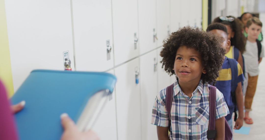 Excited School Boy Lining Up for Class in Hallway