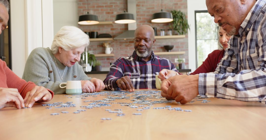 Group of Seniors Assembling Puzzle Together at Home - Free Images, Stock Photos and Pictures on Pikwizard.com