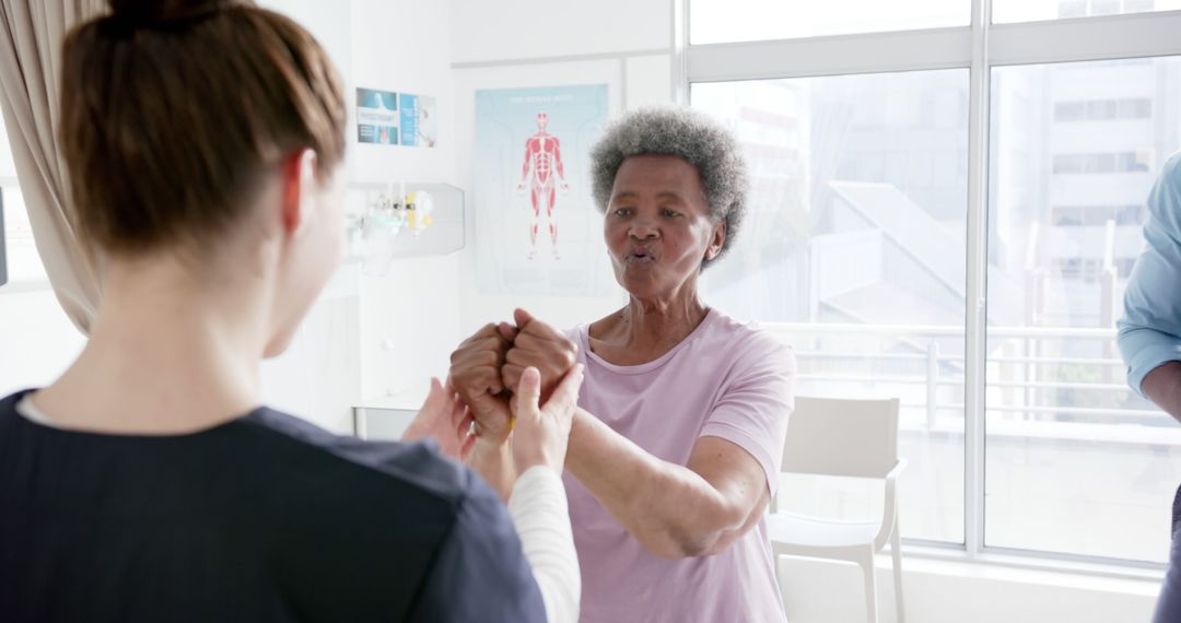 Senior Woman Engaging in Rehabilitation Exercise with Doctor - Free Images, Stock Photos and Pictures on Pikwizard.com