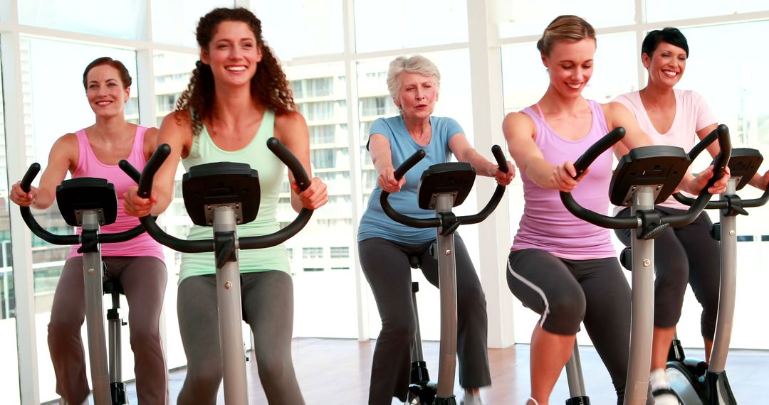 Women of Various Ages Exercising on Stationary Bikes in Gym - Free Images, Stock Photos and Pictures on Pikwizard.com