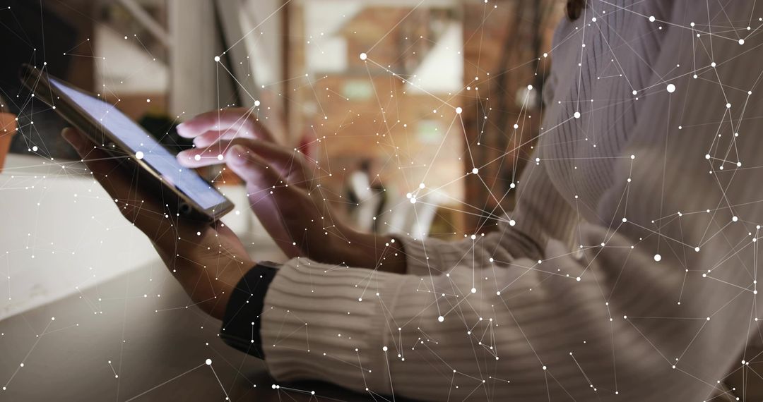 Tapping Tablet Screen While Connecting to Digital Network Overlay in Modern Office