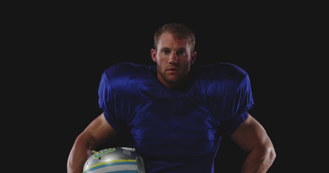 Determined American Football Player Holding Helmet Portrait - Free Images, Stock Photos and Pictures on Pikwizard.com