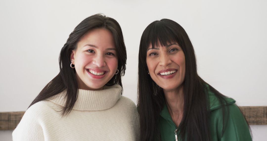 Two Smiling Women in Casual Attire in Bright Room - Free Images, Stock Photos and Pictures on Pikwizard.com