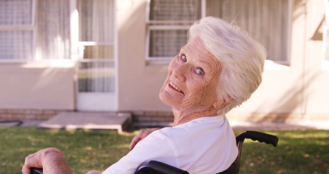 Happy Senior Woman in Wheelchair Outside Residential Home - Free Images, Stock Photos and Pictures on Pikwizard.com