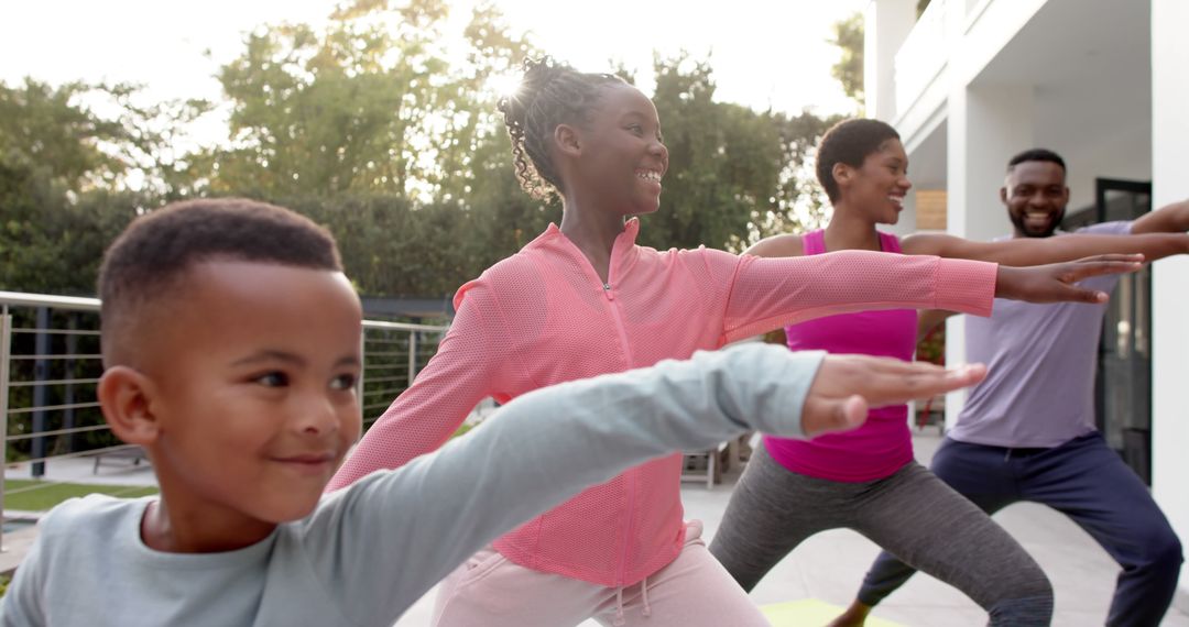 African American Family Doing Yoga in Backyard on a Sunny Day - Free Images, Stock Photos and Pictures on Pikwizard.com